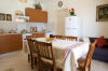The seperate kitchen/living room with dining table for 8 persons of Villa Villy